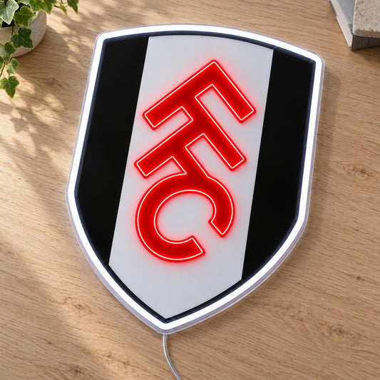 Fulham LED Neon Sign, featuring team logo displayed on a wooden surface.