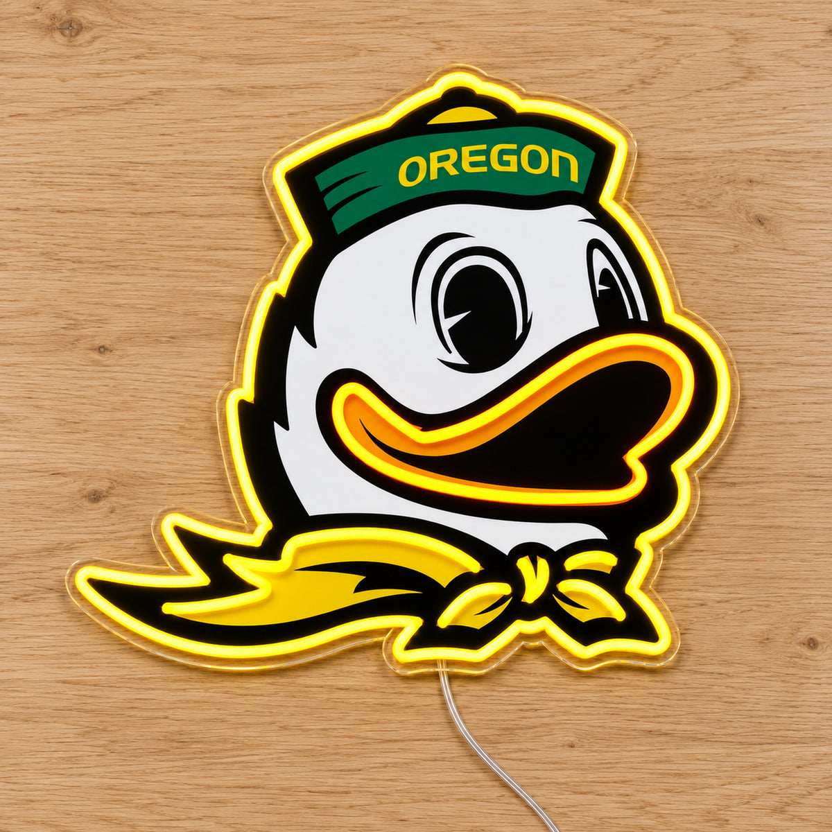 Oregon Ducks LED Neon Sign, featuring team logo displayed on a wooden surface.