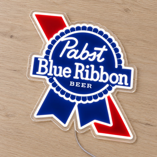 Pabst Blue Ribbon LED Neon Sign, featuring beer-brand logo displayed on a wooden surface.