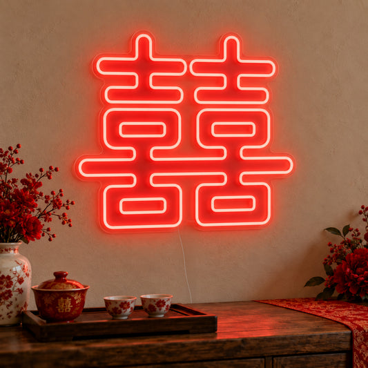 Double Happiness Red Neon Sign on clear cut-to-shape acrylic, illuminated on a wall in a styled celebration setting