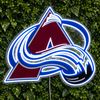 Colorado Avalanche LED Neon Sign, featuring team logo displayed on a green foliage wall.