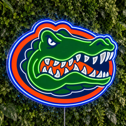 Florida Gators LED Neon Sign, featuring team logo displayed on a green foliage wall.