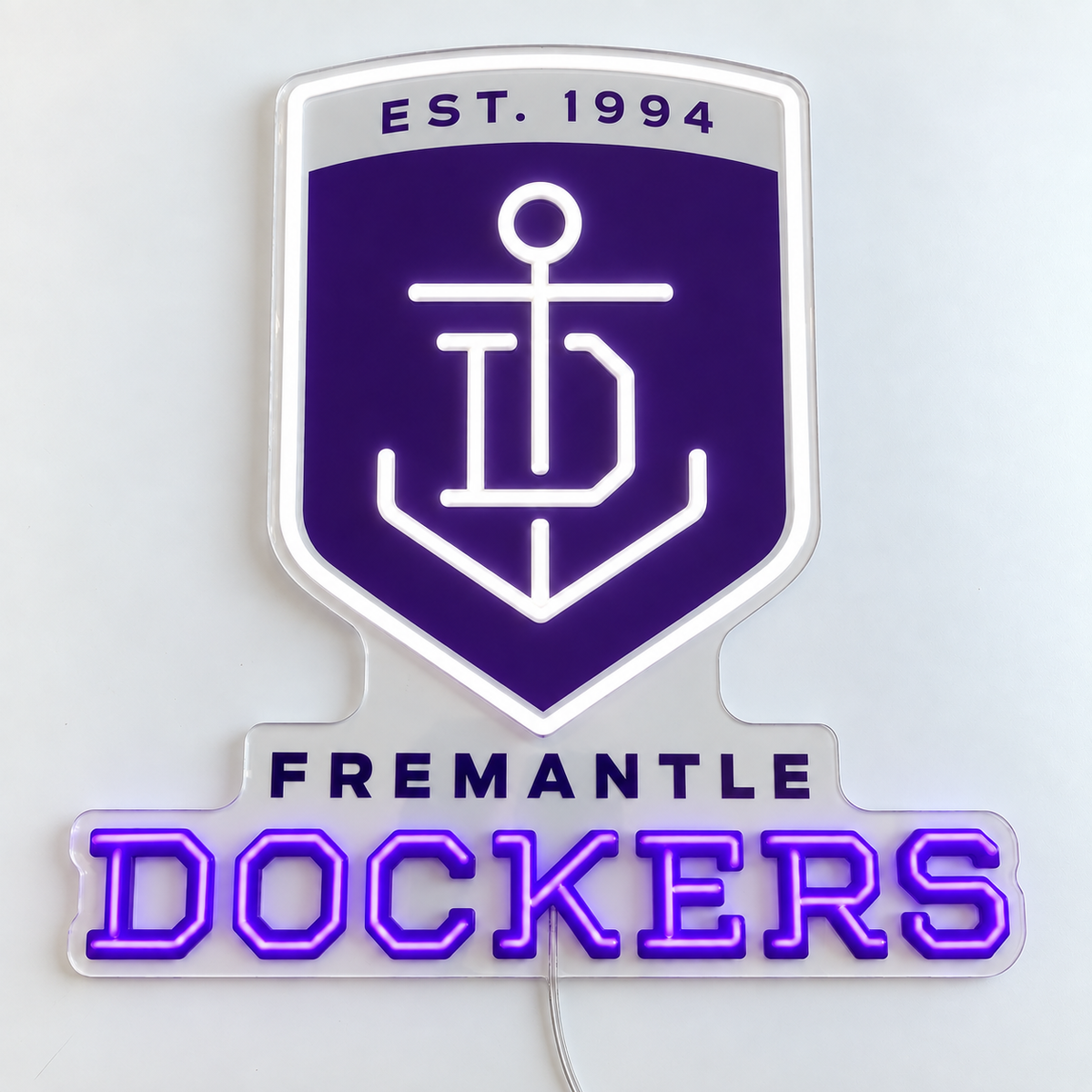 Fremantle Dockers Neon Sign with purple and white LED neon on clear acrylic, shown flat on a white surface.