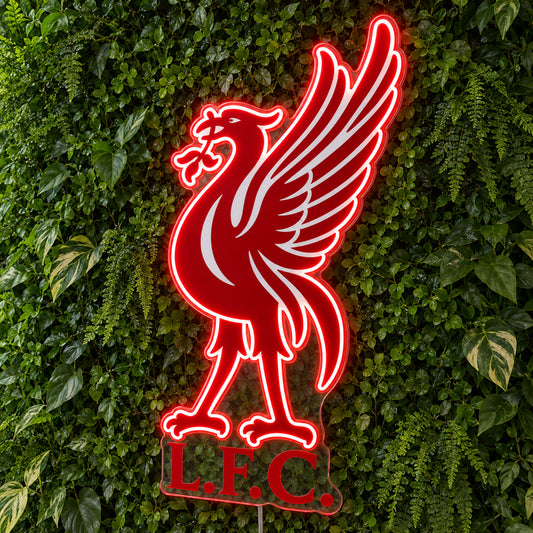 Liverpool LED Neon Sign, featuring team logo displayed on a green foliage wall.