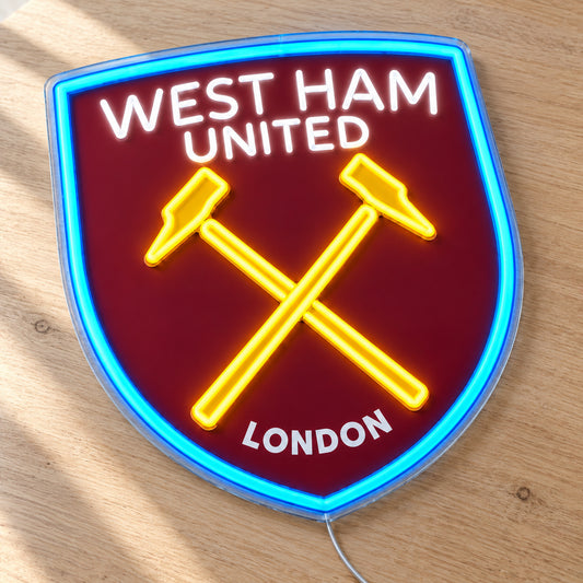 West Ham United LED Neon Sign, featuring team logo displayed on a wooden surface.