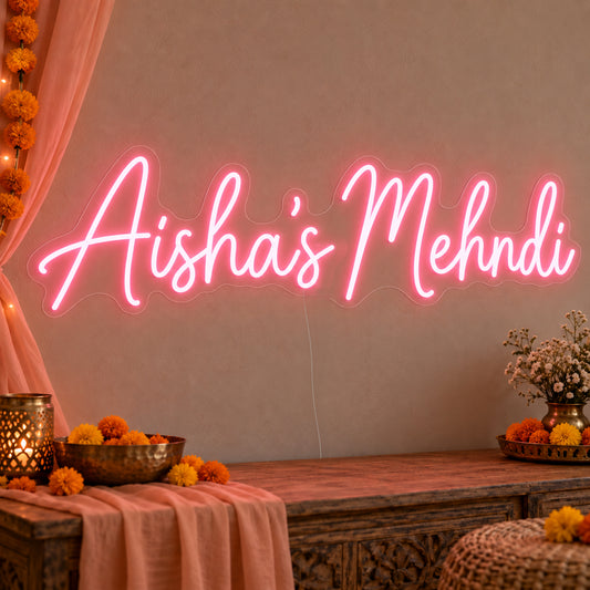 Personalised Mehndi Neon Sign on clear cut-to-shape acrylic, illuminated on a wall in a styled celebration setting; sample personalised wording shown