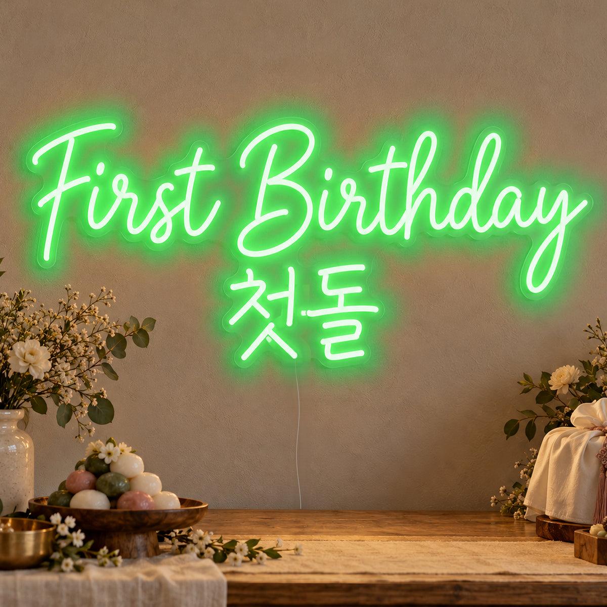 First Birthday English & Korean Neon Sign in green LED neon on clear acrylic, angled view