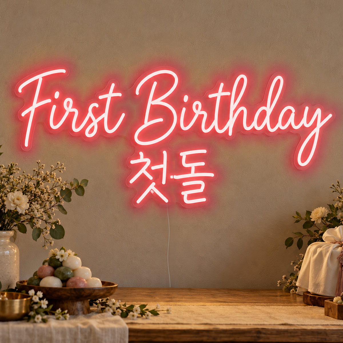 First Birthday English & Korean Neon Sign in red LED neon on clear acrylic, angled view