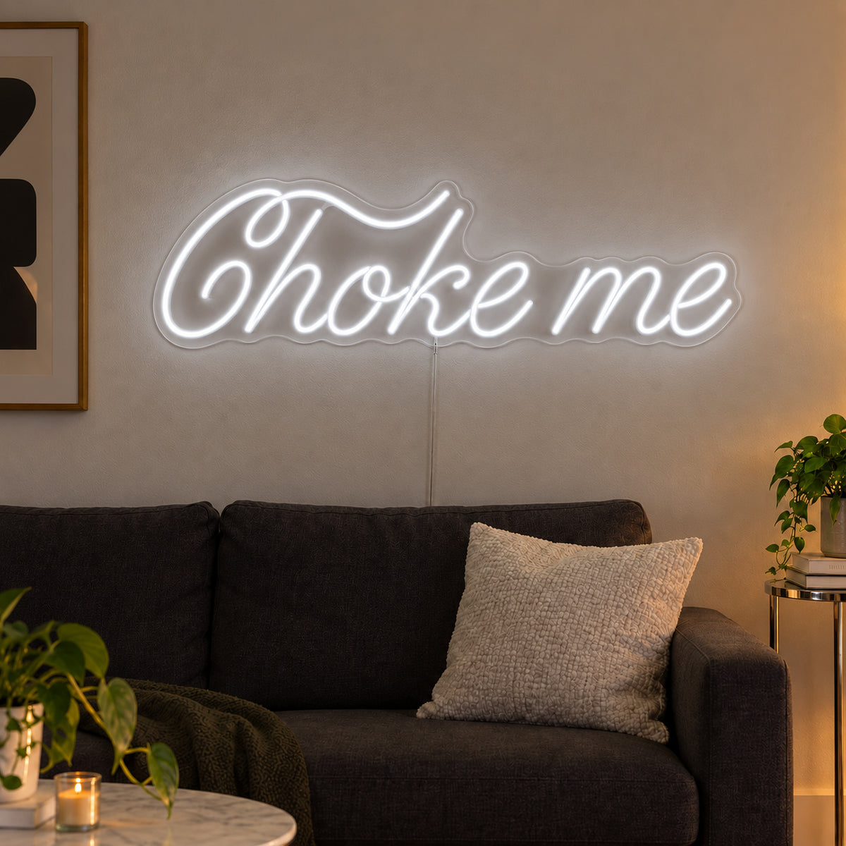 Choke Me Neon Sign, RGB colour-changing option shown in white above a charcoal sofa.