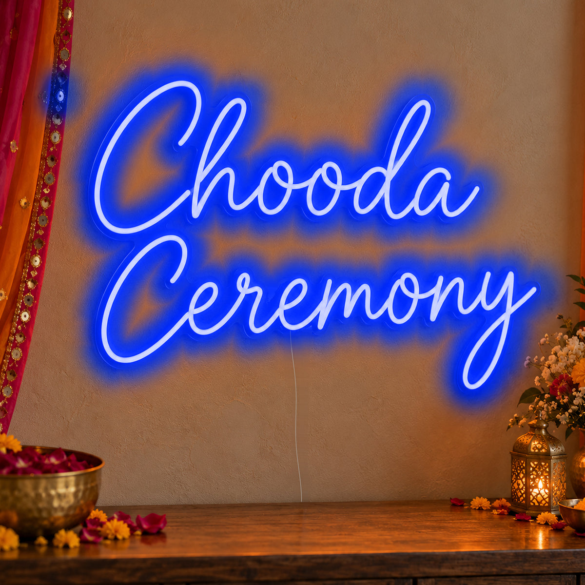 Chooda Ceremony Neon Sign in blue LED neon on clear acrylic, angled view
