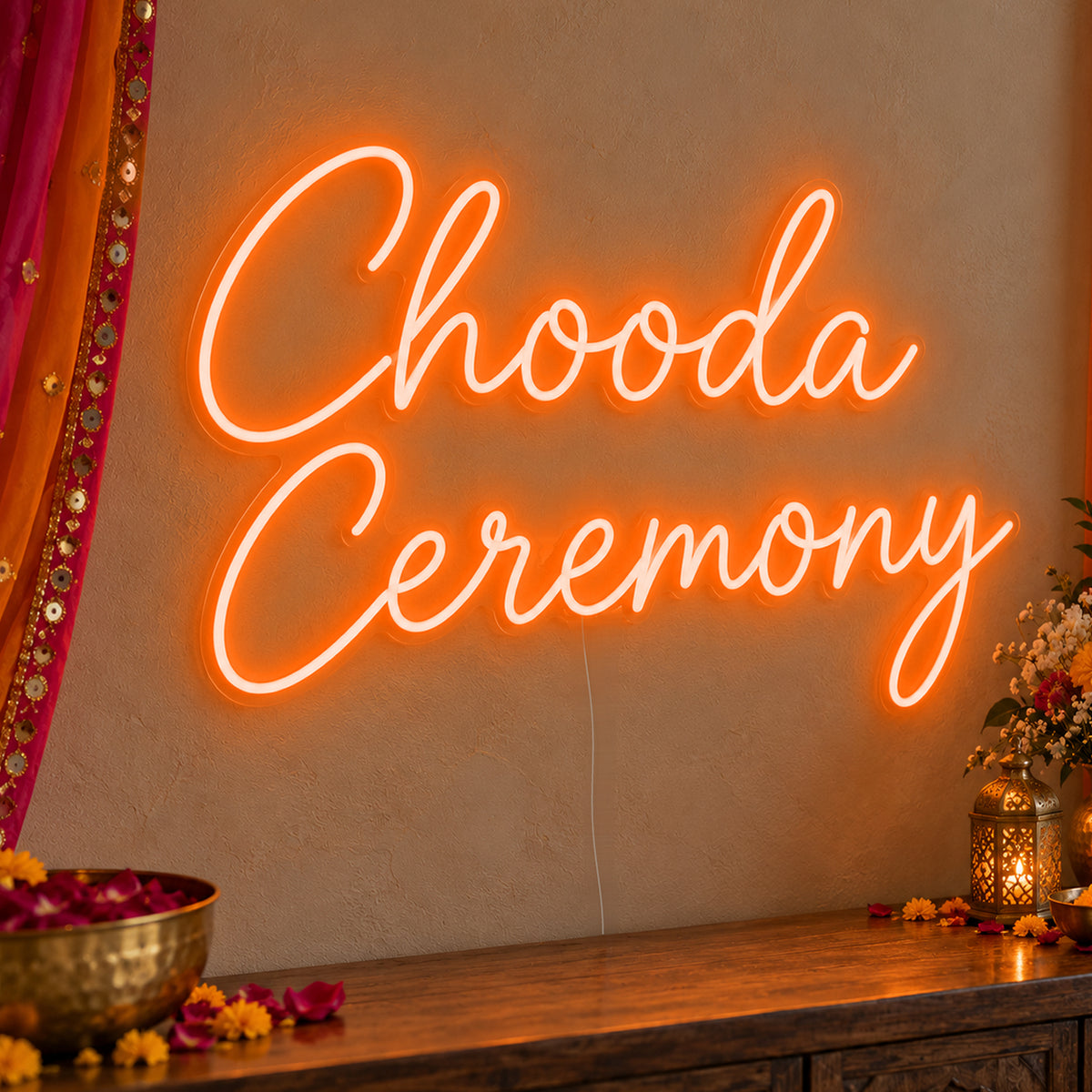 Chooda Ceremony Neon Sign in orange LED neon on clear acrylic, angled view