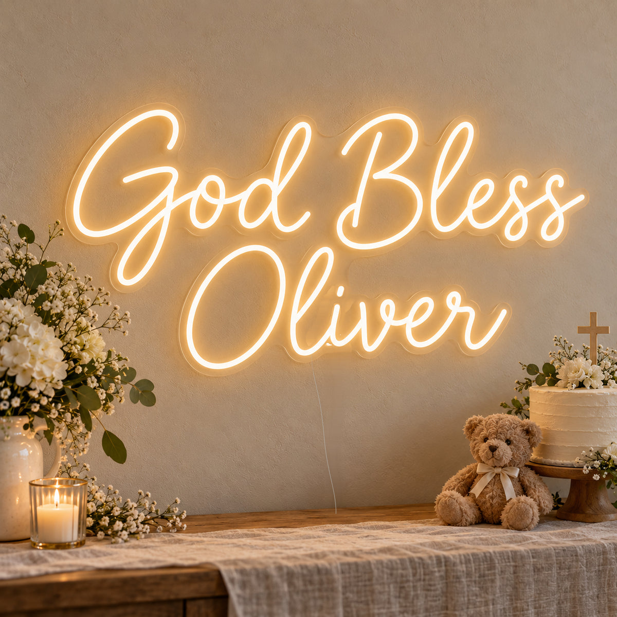 Personalised God Bless Neon Sign on clear cut-to-shape acrylic, illuminated on a wall in a styled celebration setting; sample personalised wording shown