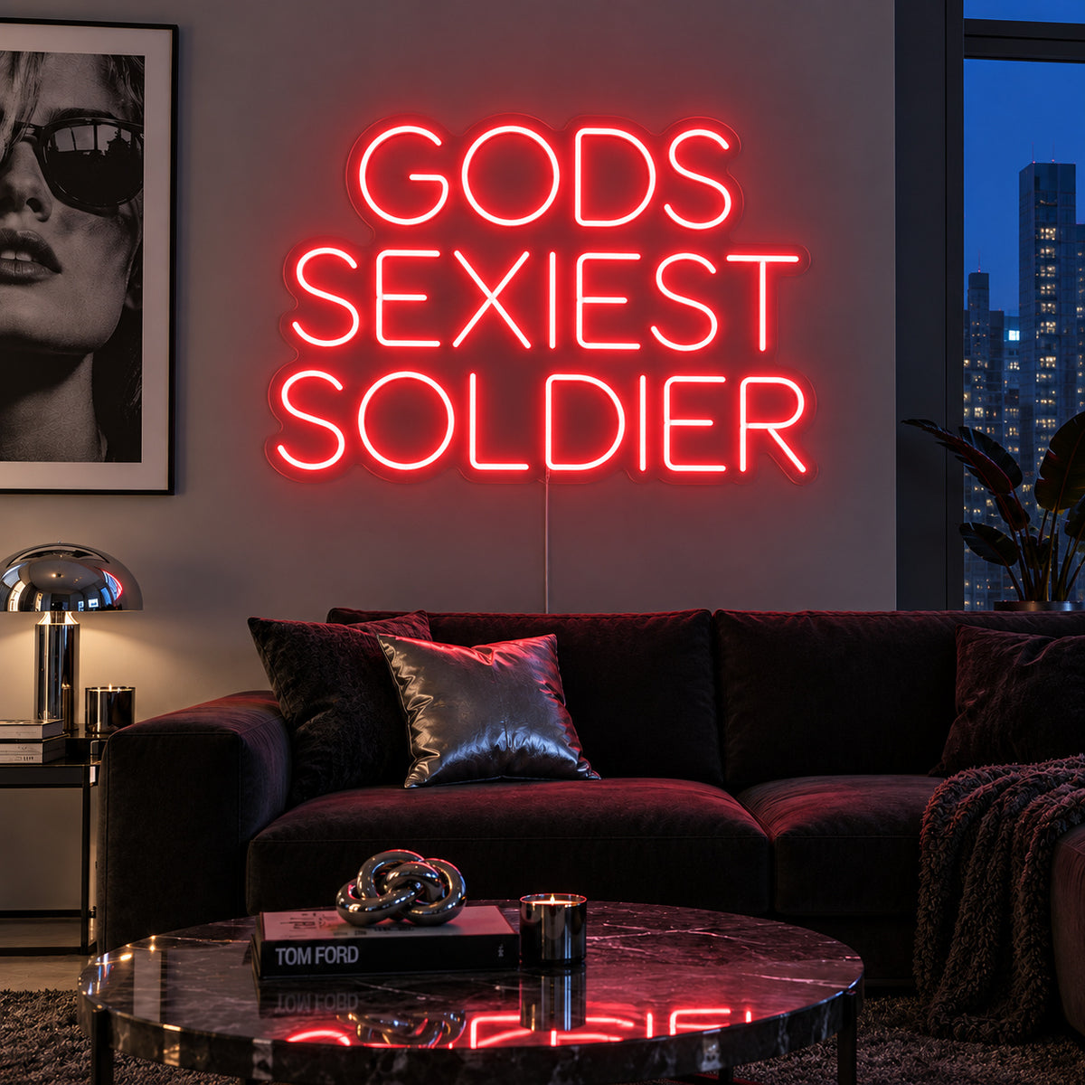 Gods Sexiest Soldier Neon Sign with red lighting, displayed in rounded lettering above a dark sofa.