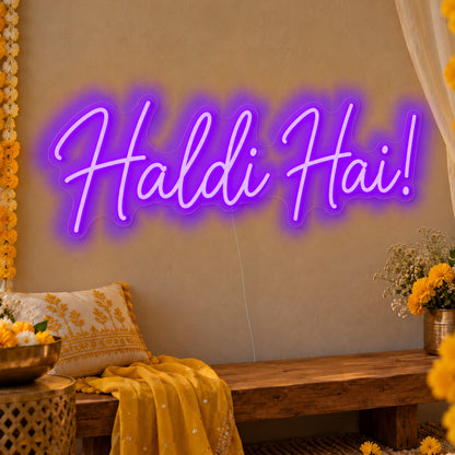 Haldi Hai Neon Sign in purple LED neon on clear acrylic, angled view