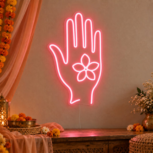 Henna Hand Neon Sign on clear cut-to-shape acrylic, illuminated on a wall in a styled celebration setting