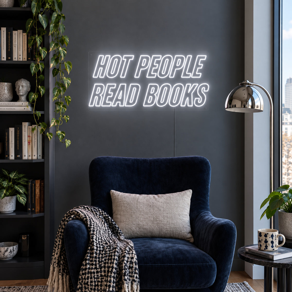 Hot People Read Books Neon Sign, RGB colour-changing option shown in white above a blue reading chair.