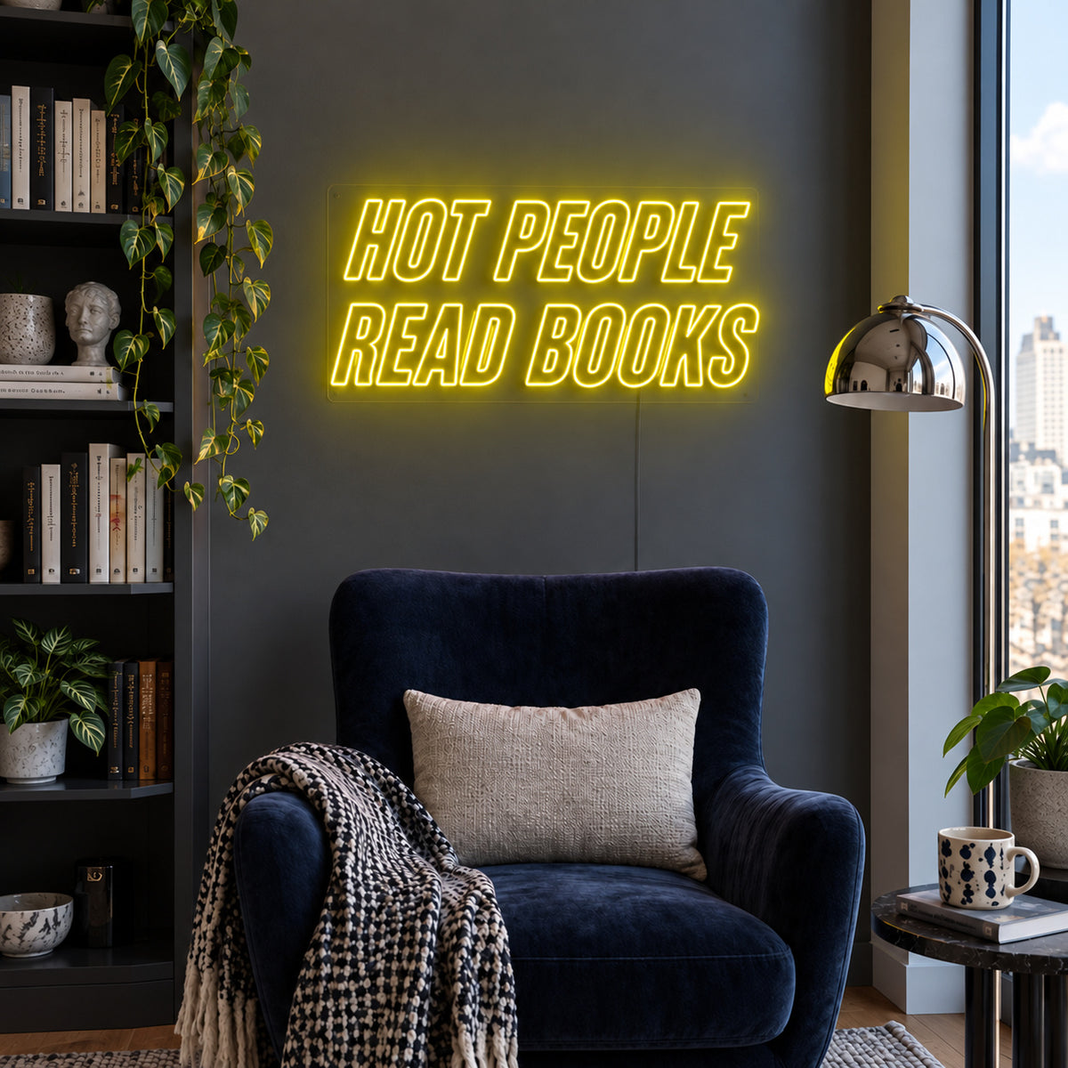 Hot People Read Books Neon Sign with yellow lighting, displayed above a blue reading chair.