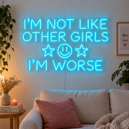 Ice Blue version of the I'm Not Like Other Girls I'm Worse Neon Sign, shown with stars and a smiley face above a cream sofa.