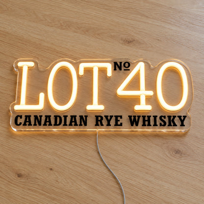 Lot No.40 LED neon sign on a light wooden surface, front view