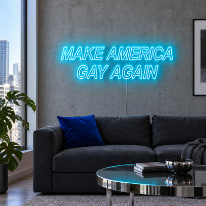 Ice Blue version of the Make America Gay Again Neon Sign, shown above a charcoal sofa.