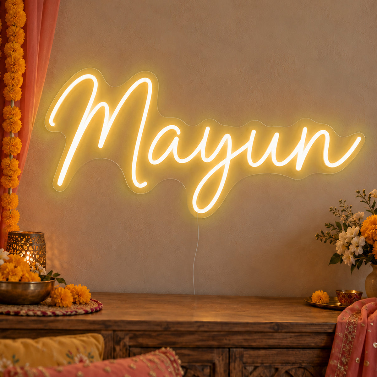 Mayun Neon Sign in gold LED neon on clear acrylic, angled view