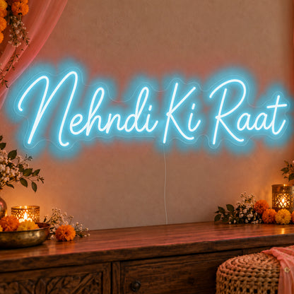Mehndi Ki Raat Neon Sign in ice blue LED neon on clear acrylic, angled view