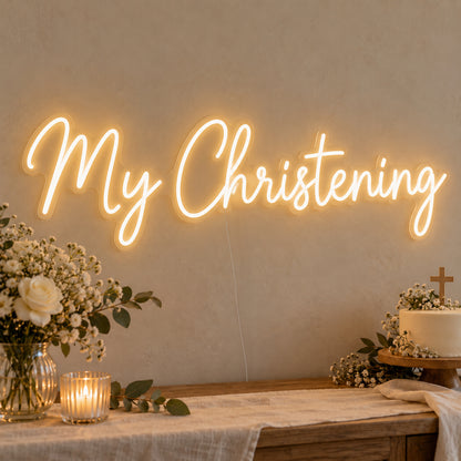 My Christening Neon Sign on clear cut-to-shape acrylic, illuminated on a wall in a styled celebration setting