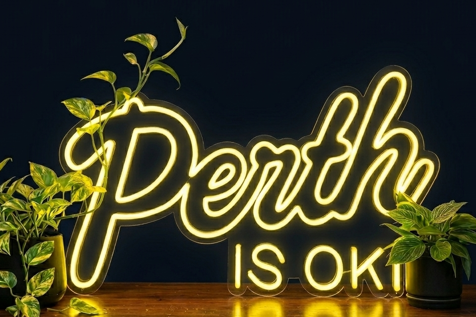 Perth is OK! neon sign on a dark background with plants, shown as custom sign inspiration for Mount Lawley.