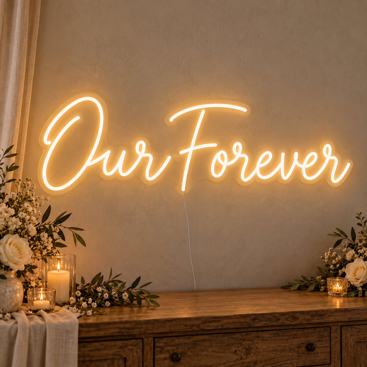 Our Forever Neon Sign on clear cut-to-shape acrylic, illuminated on a wall in a styled celebration setting