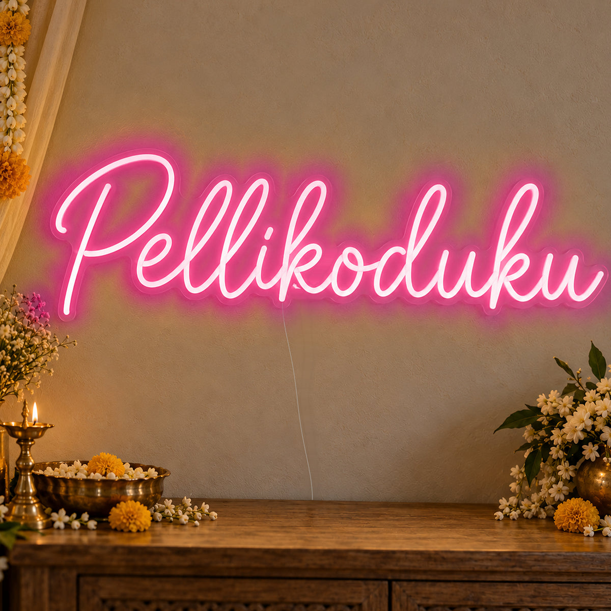 Pellikoduku Neon Sign in rose red LED neon on clear acrylic, angled view