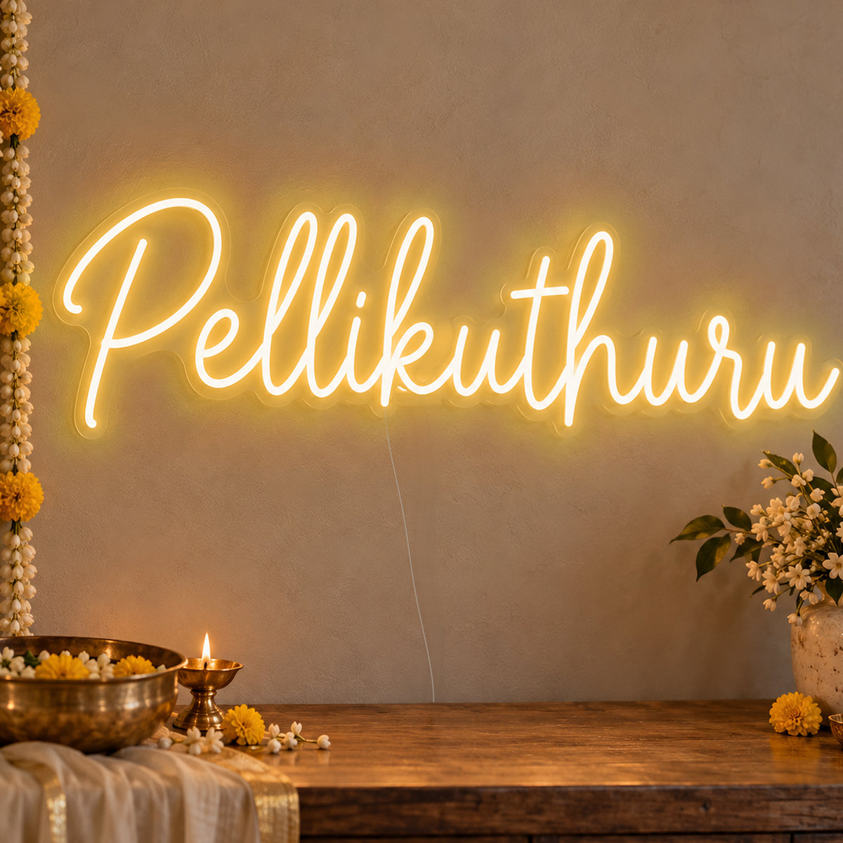 Pellikuthuru Neon Sign in gold LED neon on clear acrylic, angled view
