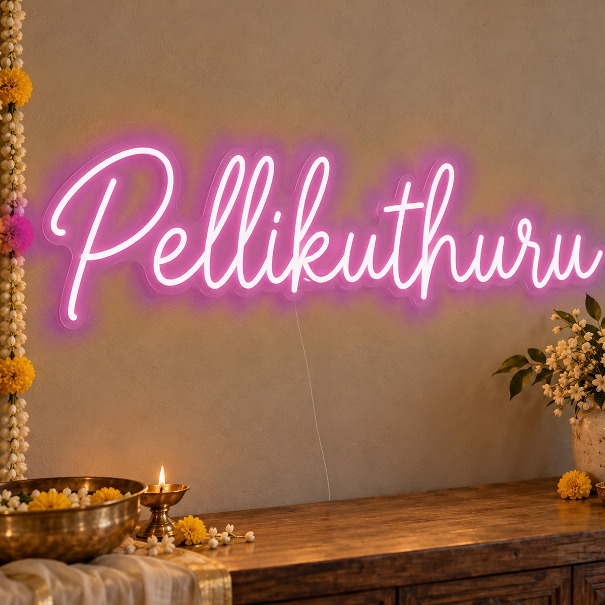 Pellikuthuru Neon Sign in pink LED neon on clear acrylic, angled view