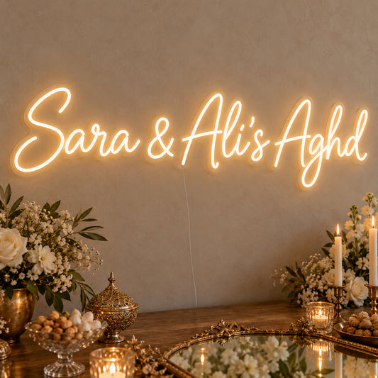 Personalised Aghd Neon Sign on clear cut-to-shape acrylic, illuminated on a wall in a styled celebration setting; sample personalised wording shown
