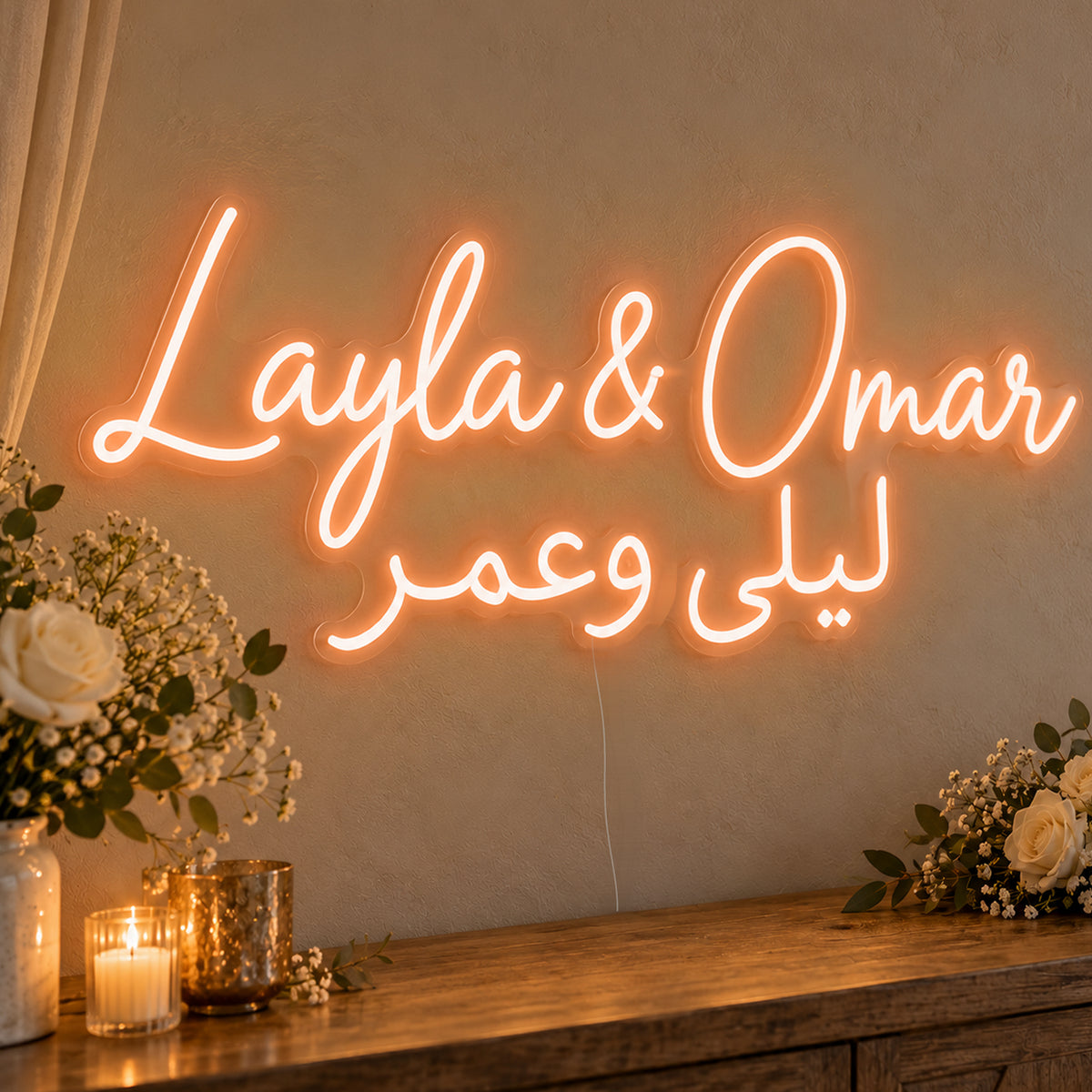 Personalised Bilingual Arabic English Names Neon Sign in orange LED neon on clear acrylic, angled view