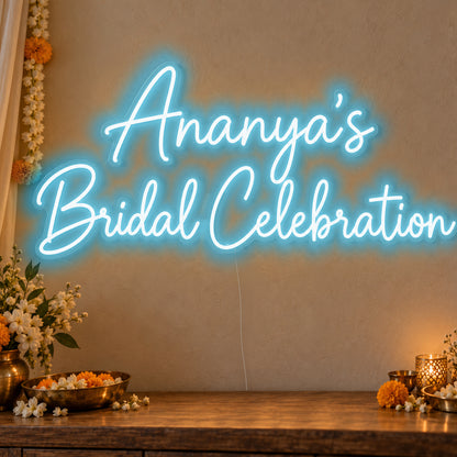Personalised Bridal Celebration Neon Sign in ice blue LED neon on clear acrylic, angled view