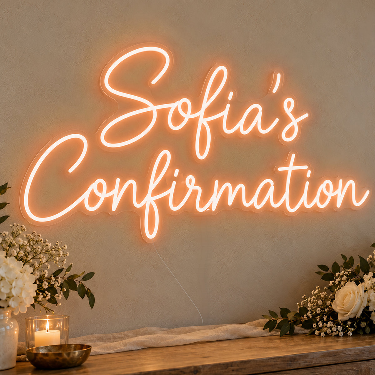 Personalised Confirmation Neon Sign in orange LED neon on clear acrylic, angled view