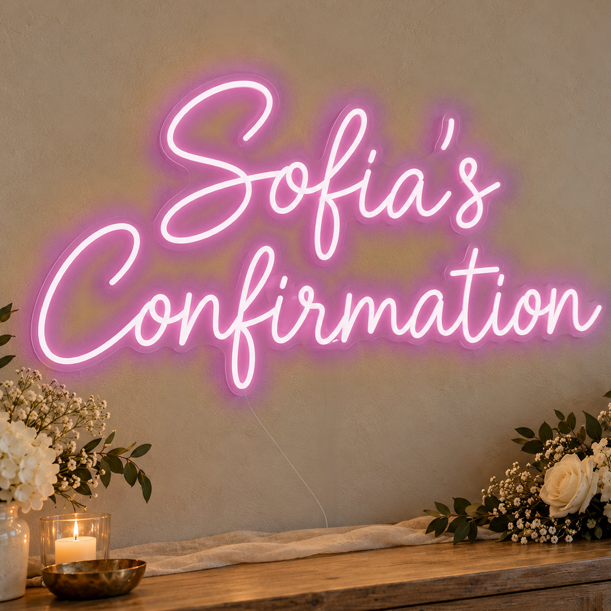 Personalised Confirmation Neon Sign in pink LED neon on clear acrylic, angled view
