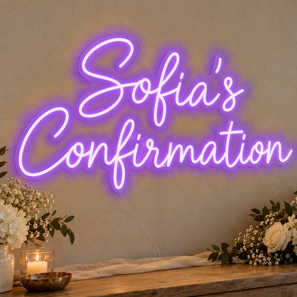 Personalised Confirmation Neon Sign in purple LED neon on clear acrylic, angled view