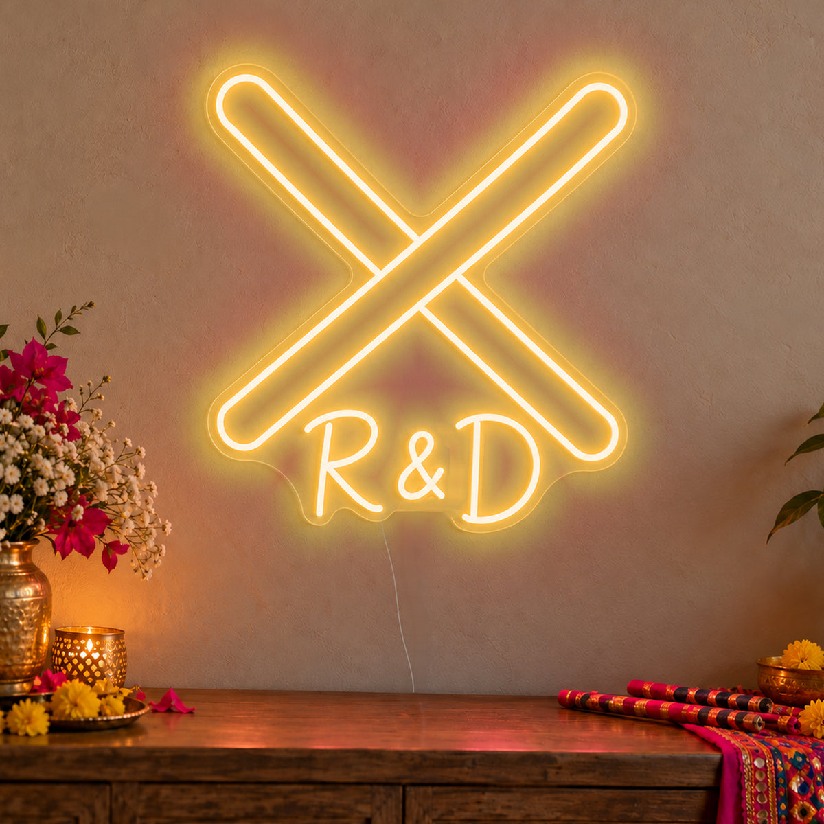 Personalised Dandiya Initials Neon Sign in gold LED neon on clear acrylic, angled view