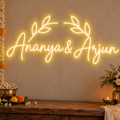 Personalised Floral Arch Names Neon Sign in gold LED neon on clear acrylic, angled view