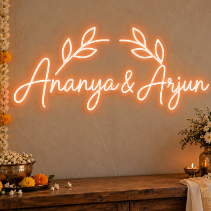 Personalised Floral Arch Names Neon Sign in orange LED neon on clear acrylic, angled view