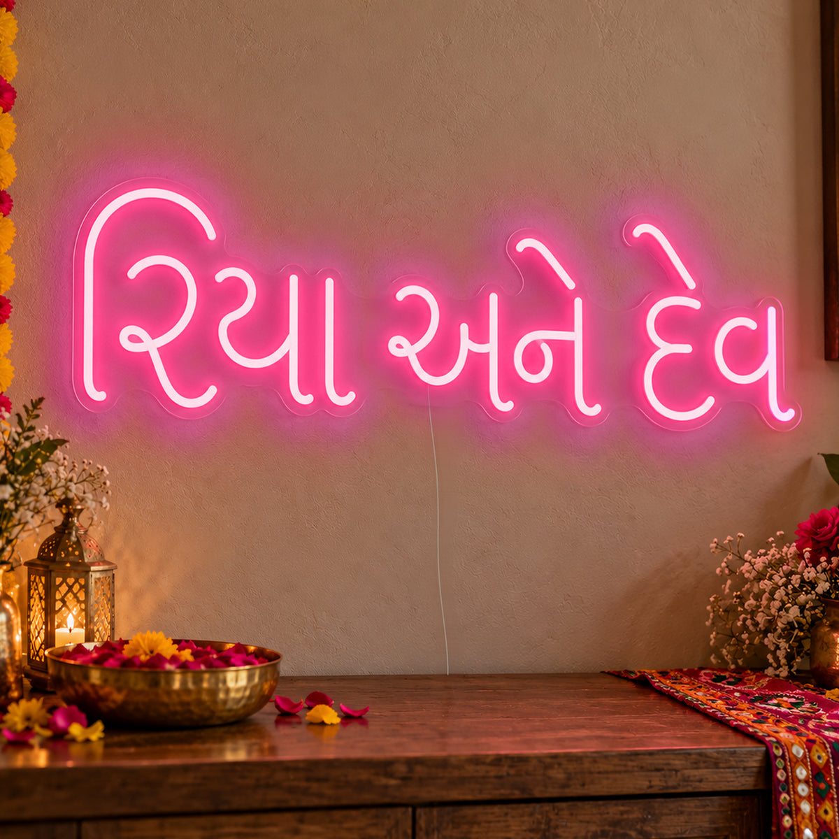 Personalised Gujarati Couple Names Neon Sign in rose red LED neon on clear acrylic, angled view