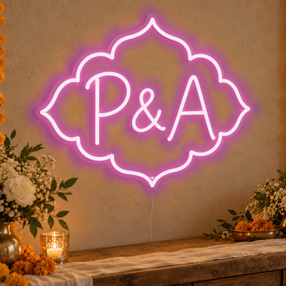 Personalised Marigold Initials Neon Sign in pink LED neon on clear acrylic, angled view