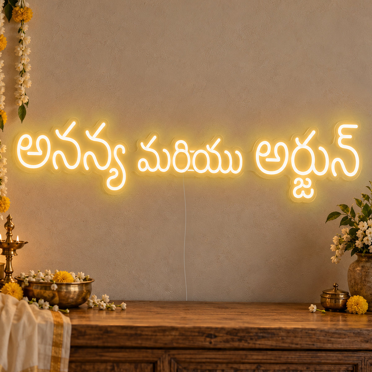 Personalised Telugu Couple Names Neon Sign in gold LED neon on clear acrylic, angled view
