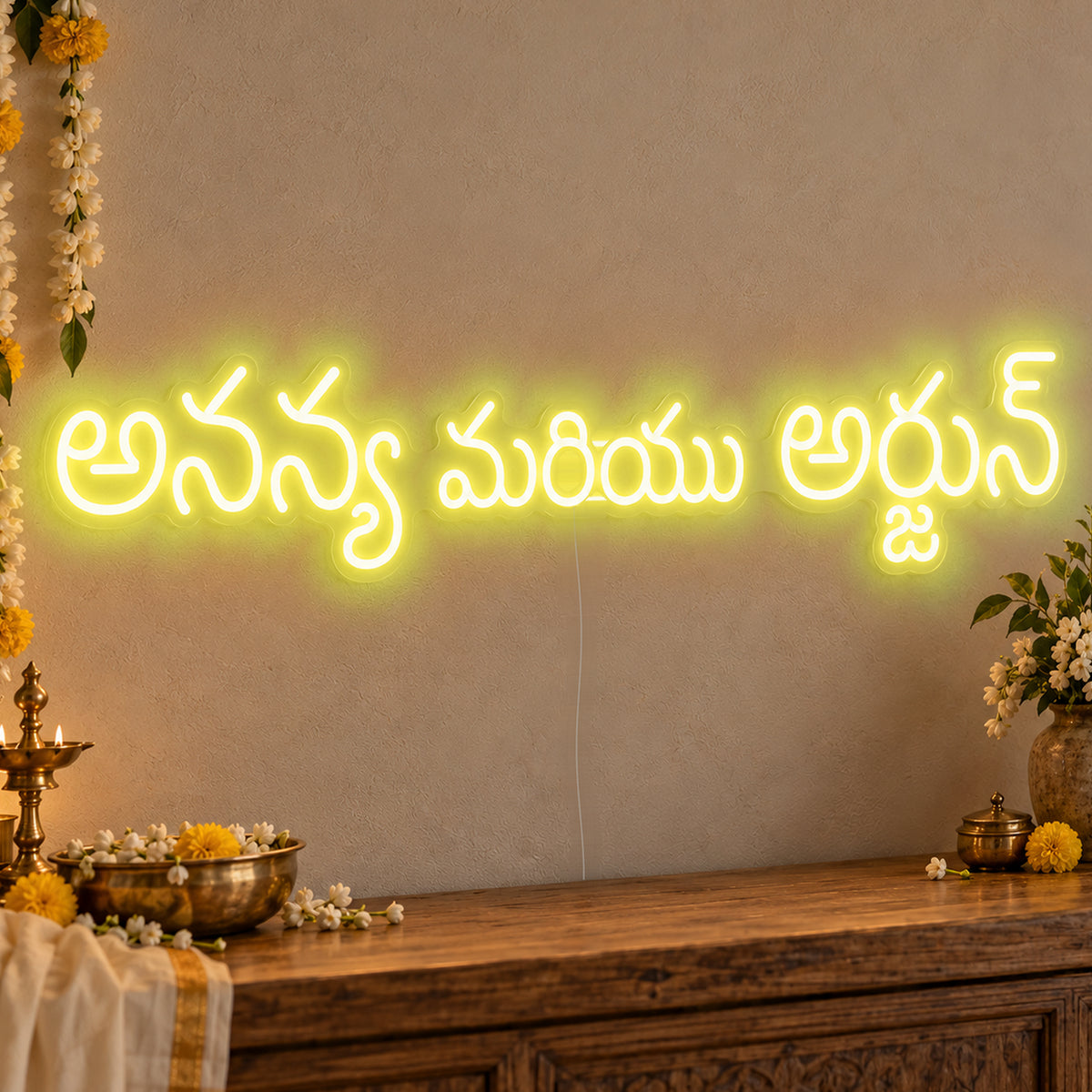 Personalised Telugu Couple Names Neon Sign in yellow LED neon on clear acrylic, angled view