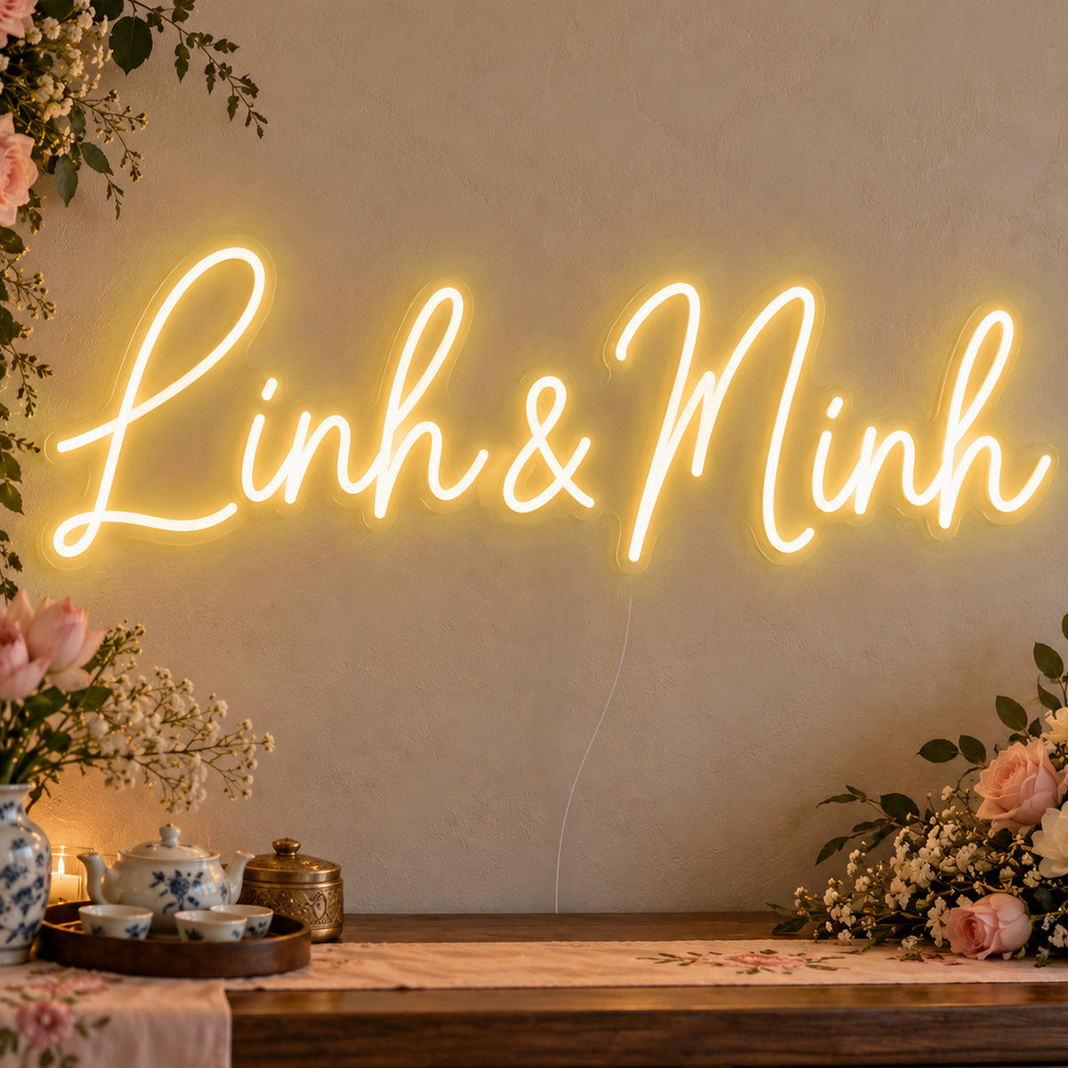 Personalised Vietnamese Couple Names Neon Sign in gold LED neon on clear acrylic, angled view