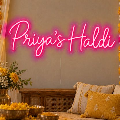 Personalised Haldi Neon Sign in rose red LED neon on clear acrylic, angled view