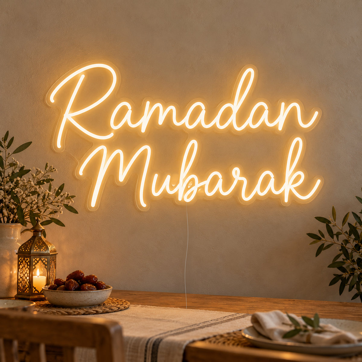 Ramadan Mubarak Neon Sign on clear cut-to-shape acrylic, illuminated on a wall in a styled celebration setting