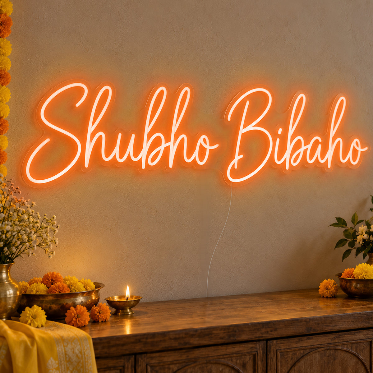 Shubho Bibaho Neon Sign in orange LED neon on clear acrylic, angled view
