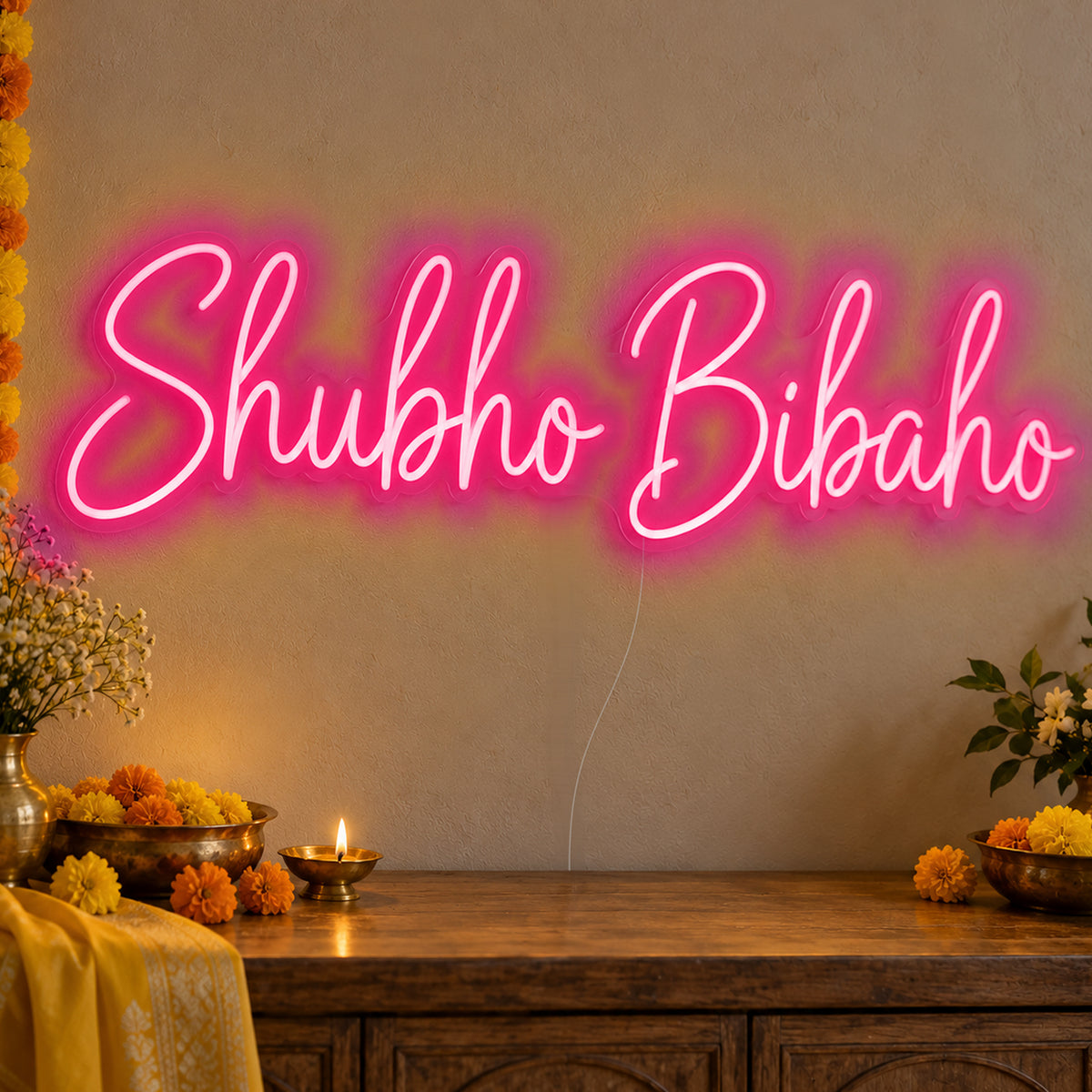 Shubho Bibaho Neon Sign in rose red LED neon on clear acrylic, angled view